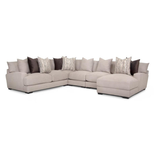 Beige sectional sofa with assorted pillows.