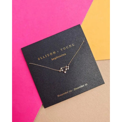 Sagittarius constellation necklace on colorful background.