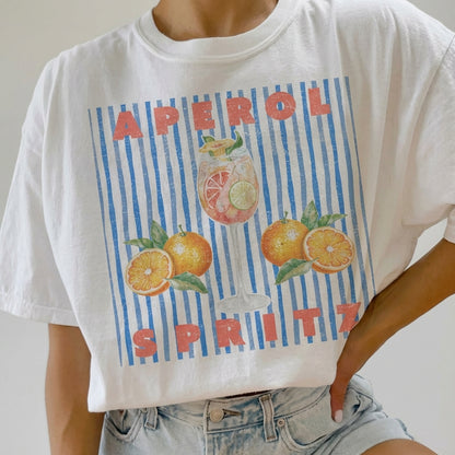 White t-shirt with "Aperol Spritz" and citrus design.