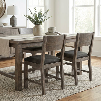 Rustic dining set with vase, plates, and natural light.