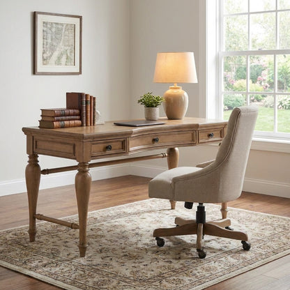 A cozy home office with a wooden desk, upholstered chair, and sunlit window.