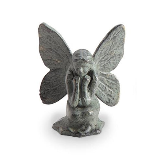 Stone fairy figurine with large wings.