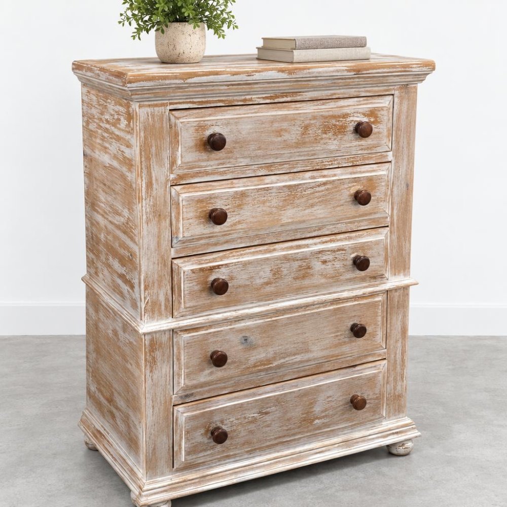 Vintage wooden dresser with distressed finish and decor on top.