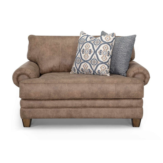 Brown loveseat with two patterned cushions on it.