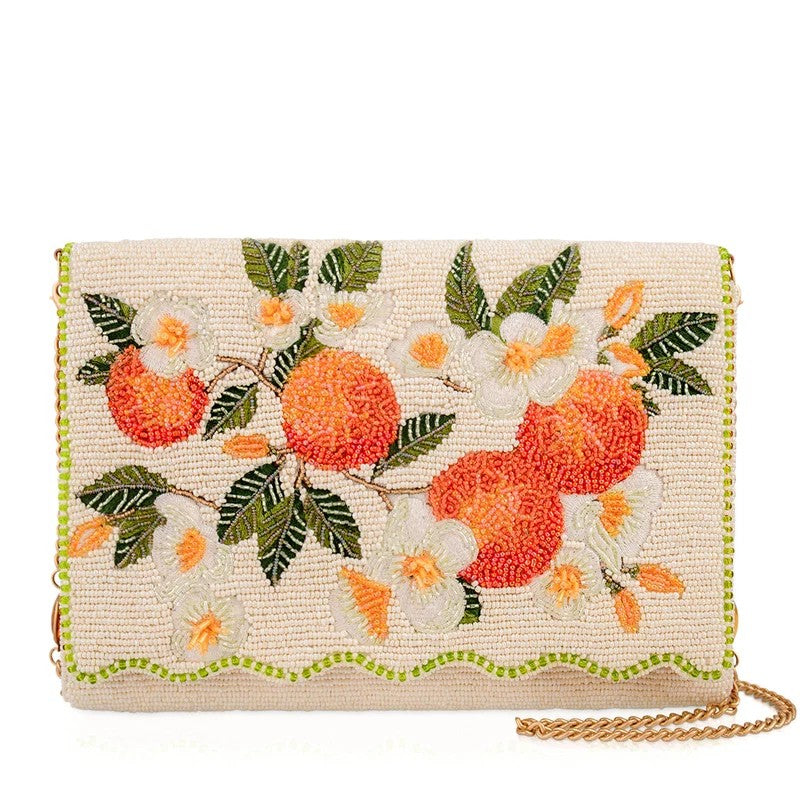 Embroidered clutch with oranges and flowers, gold chain strap.