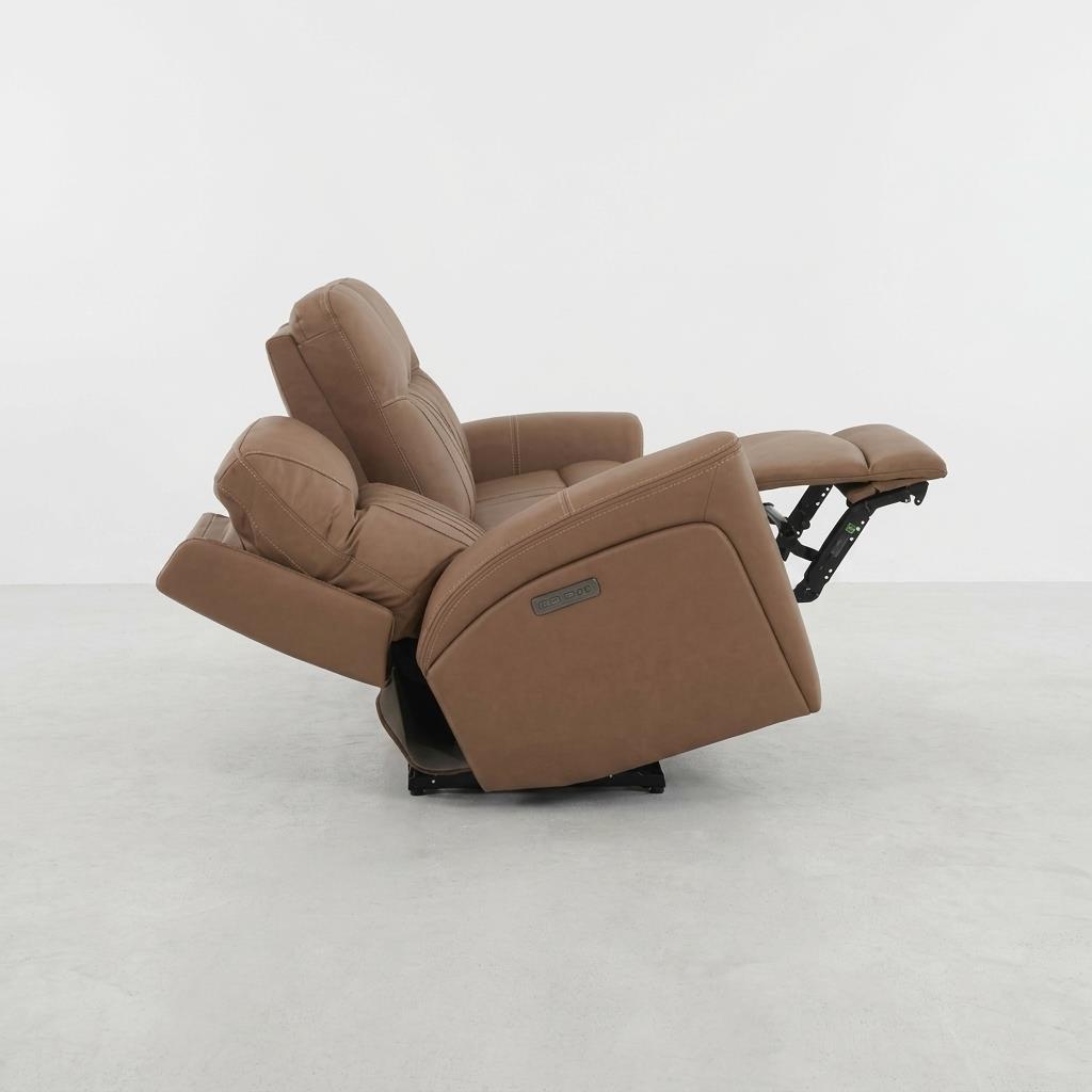 Brown recliner chair fully extended on a white background.