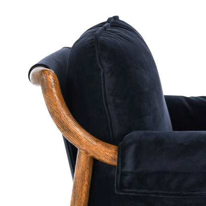 Wooden armrest with black cushioned backrest detail.