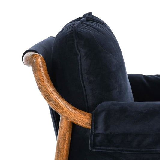 Wooden armrest with black cushioned backrest detail.