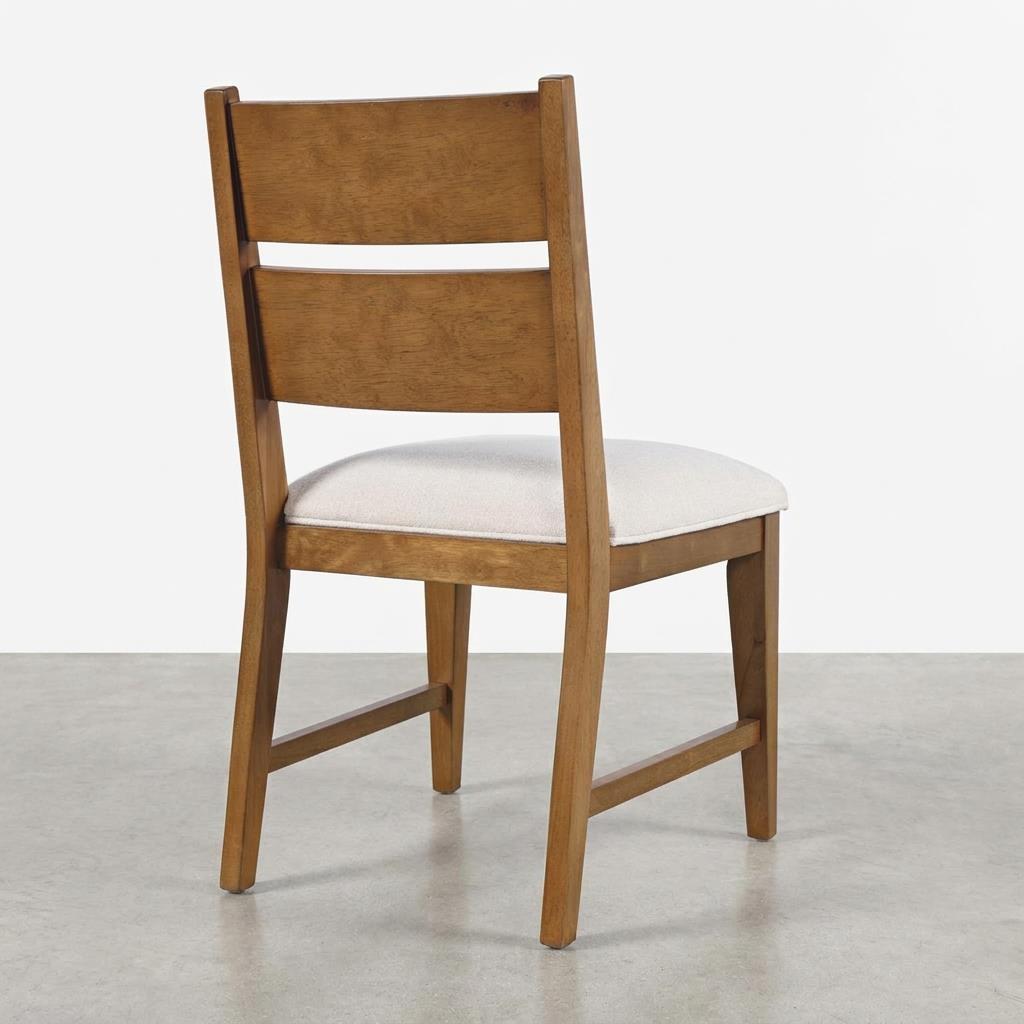Wooden chair with a cushioned seat, viewed from the back.