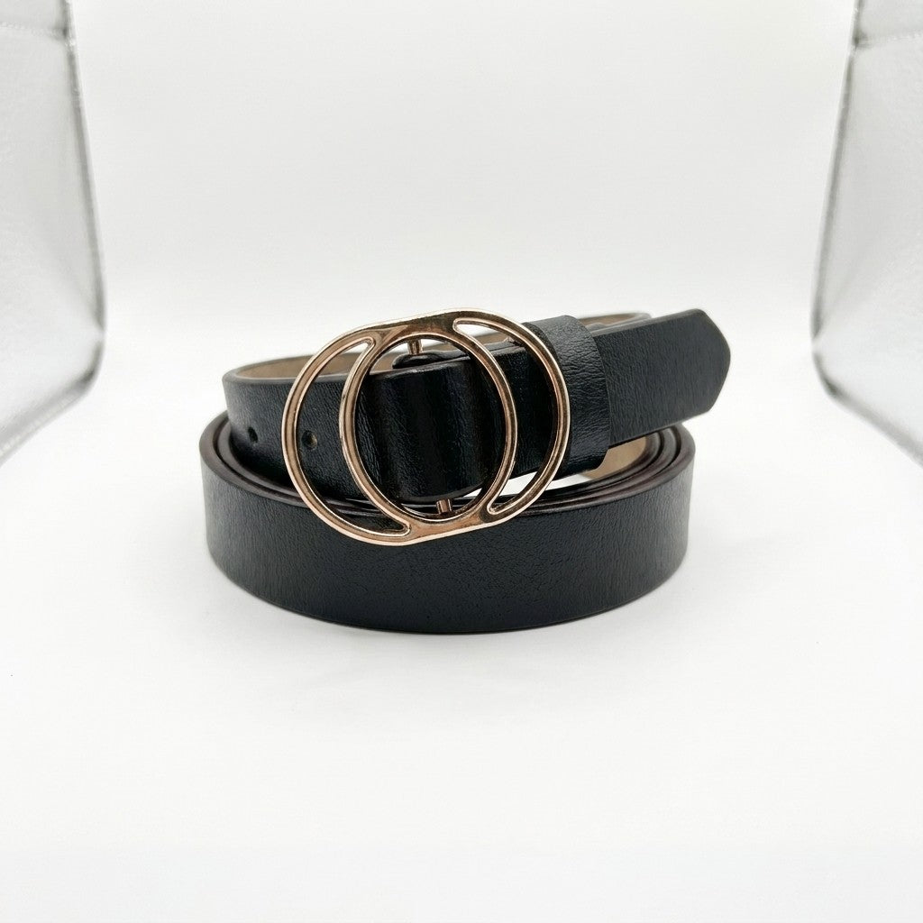 Black belt with a double-ring gold buckle on a white background.