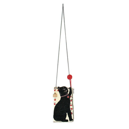Cat-themed crossbody bag with a chain strap and red pom-pom accessory.