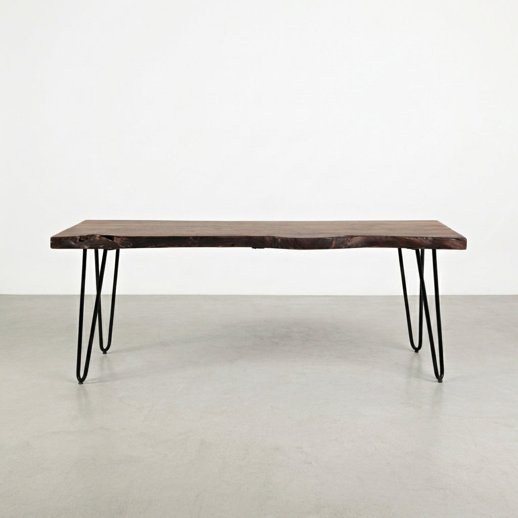 Wooden table with metal hairpin legs on white background.