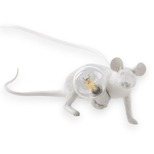 White mouse sculpture holding a light bulb.