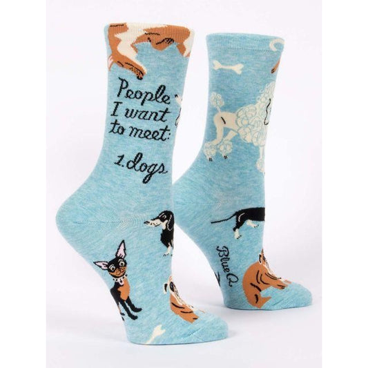 Blue socks with dogs and "People I want to meet: 1. Dogs" text.