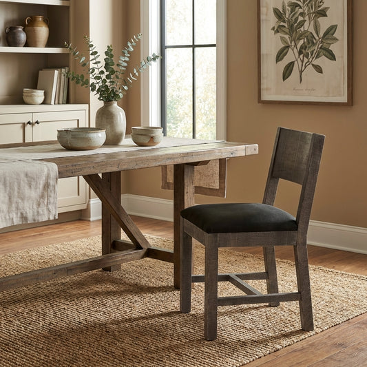 Wooden chair with a black cushioned seat and a simple backrest.