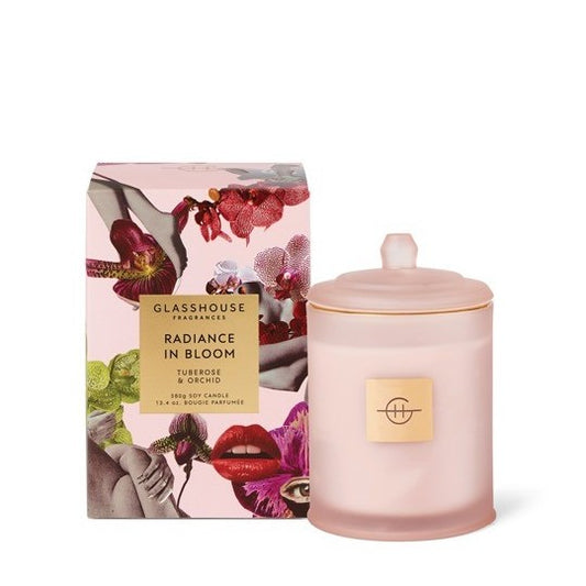 Pink candle with floral box, labeled "Radiance in Bloom."