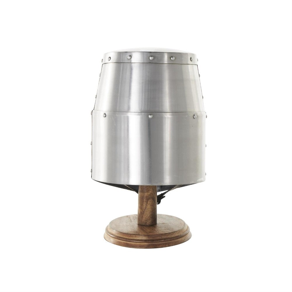 Metal helmet on a wooden stand, isolated on white background.
