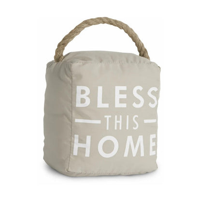 Beige doorstop with "Bless This Home" text and a rope handle.