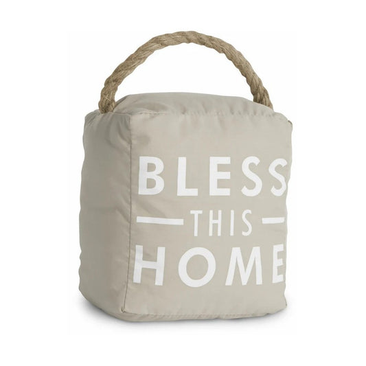Beige doorstop with "Bless This Home" text and a rope handle.