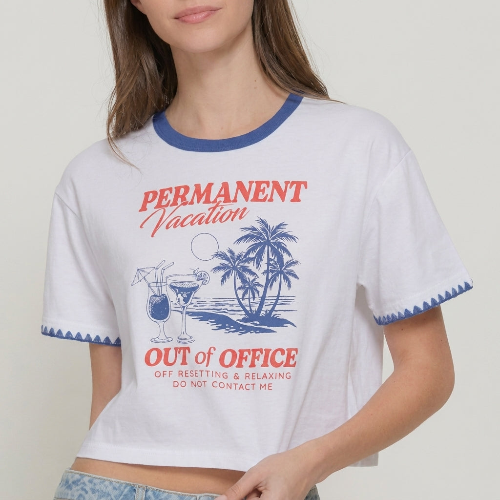 Woman wearing a T-shirt saying "Permanent Vacation, Out of Office."