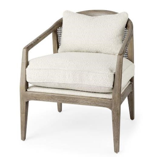 Wooden chair with white cushions and a woven back.
