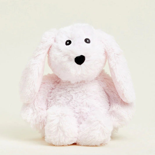 Fluffy white stuffed animal with floppy ears on a plain background.