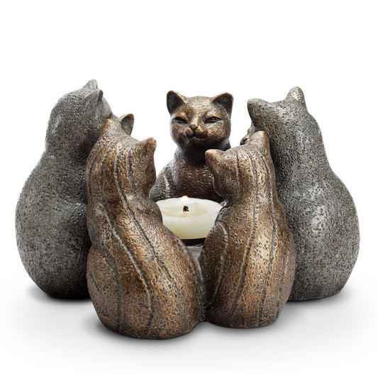 Cat statues encircle a candle in a circle.