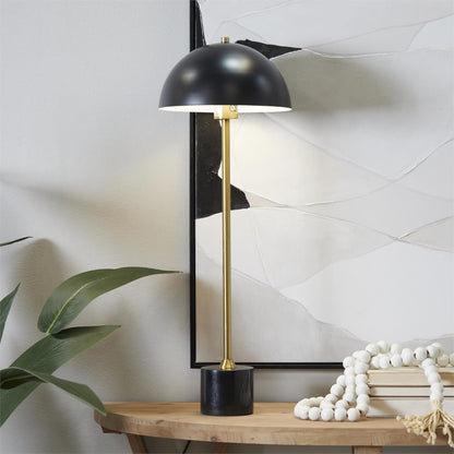 Modern lamp on wooden table, abstract art, plant decor.