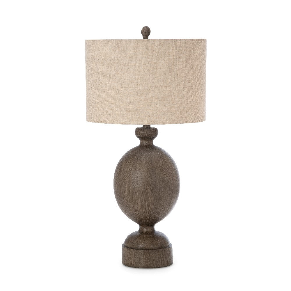 Rustic table lamp with a beige shade and wooden base.