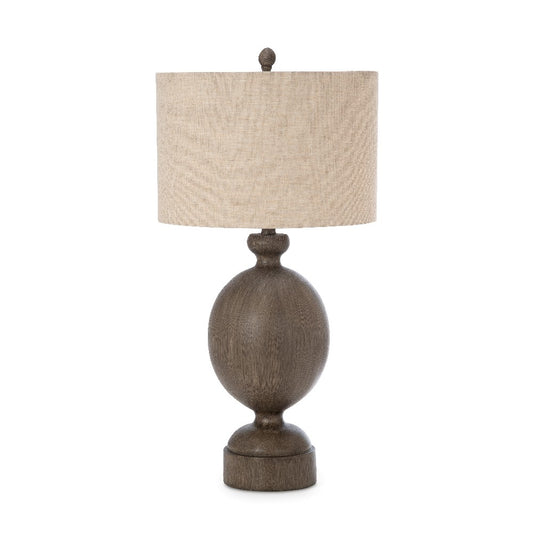 Rustic table lamp with a beige shade and wooden base.