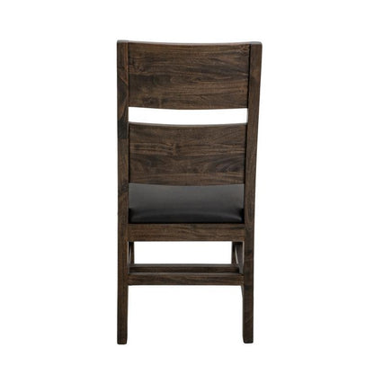 Dark wooden chair with padded seat, viewed from the back.