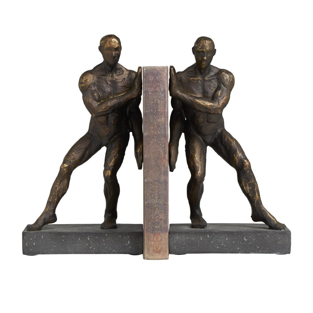 Two bronze statues holding a book on a stone base.