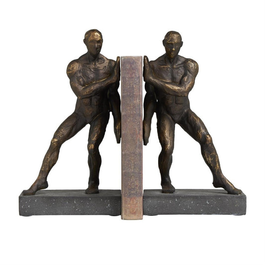 Two bronze statues holding a book on a stone base.