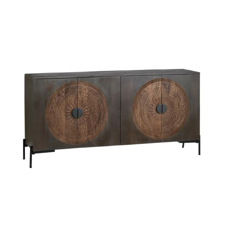 Dark wooden sideboard with intricate circular carvings and metal legs.