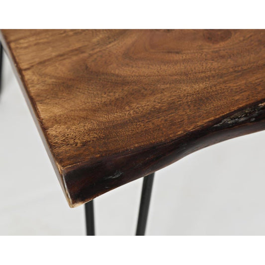 Close-up of wooden tabletop with natural edge and metal legs.