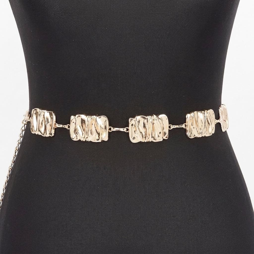 Gold chain belt with textured links on black mannequin.