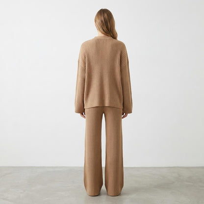 Person in beige knitwear set, facing away.