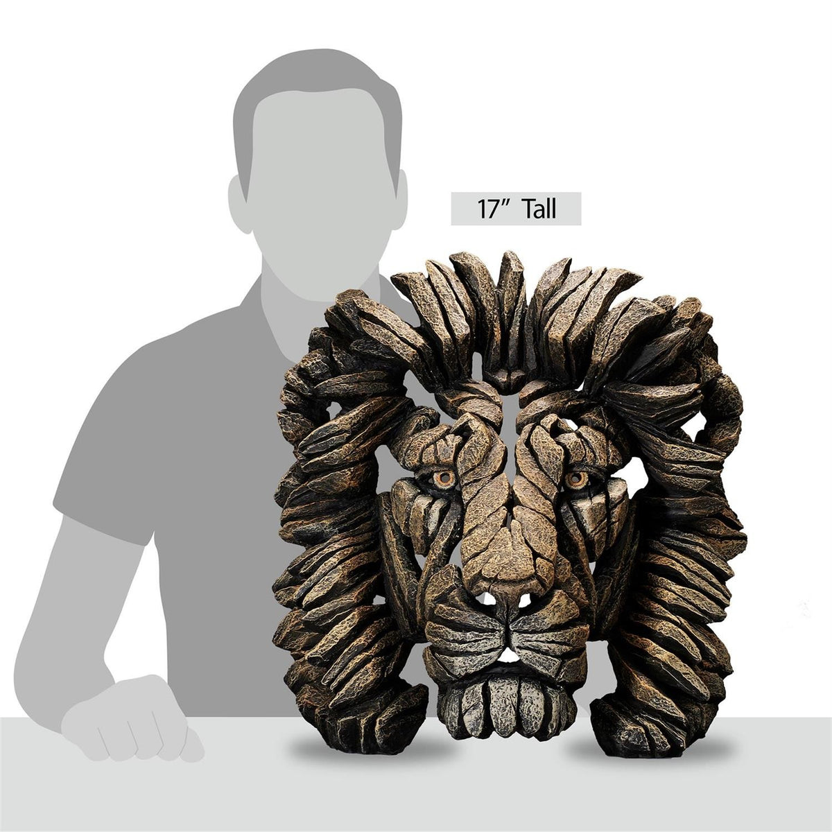 17" lion sculpture in front of a shaded human figure.