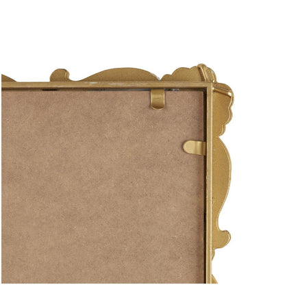 Gold ornate picture frame back corner.