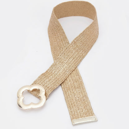 Beige woven belt with a clover buckle on a white background.