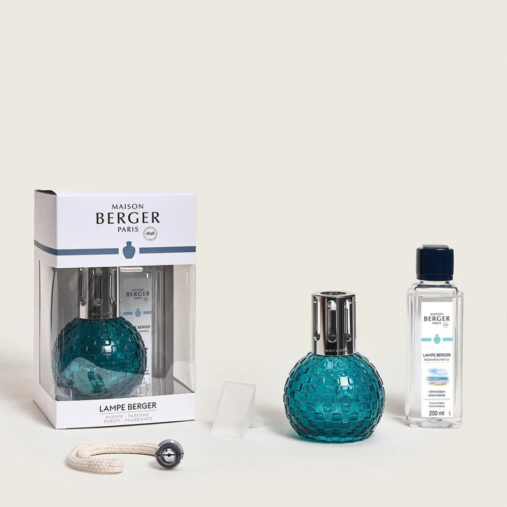 Maison Berger Paris lamp set with teal mosaic lamp and fragrance bottle.