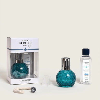 Maison Berger Paris lamp set with teal mosaic lamp and fragrance bottle.