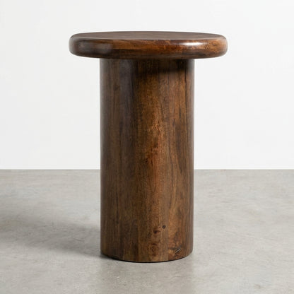 Round wooden side table with a smooth finish.