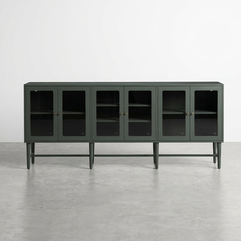 Green cabinet with glass doors and interior shelves.