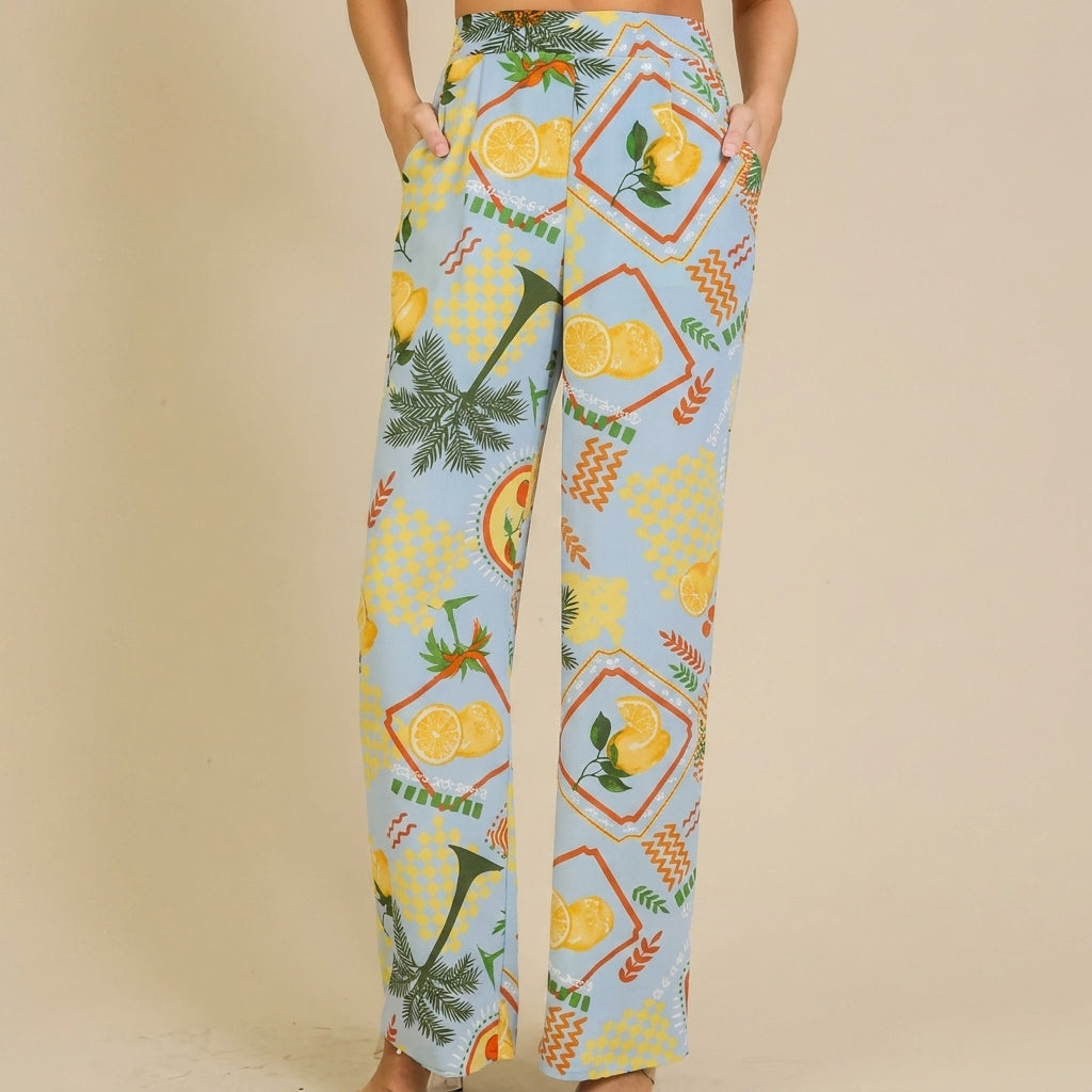 Colorful, lemon-patterned wide-leg pants with pockets and a relaxed fit.