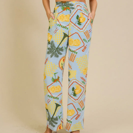 Colorful, lemon-patterned wide-leg pants with pockets and a relaxed fit.