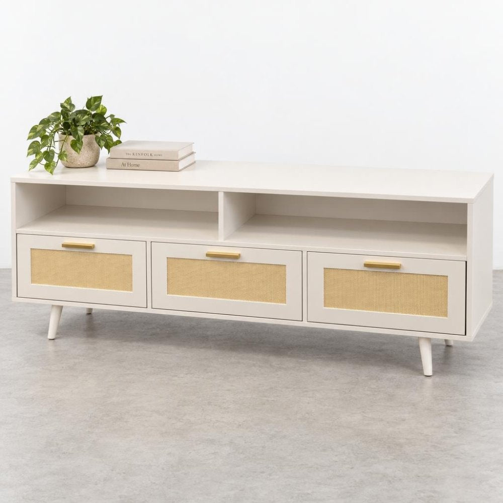 A white media console with cane-front drawers, open shelves, and gold handles.