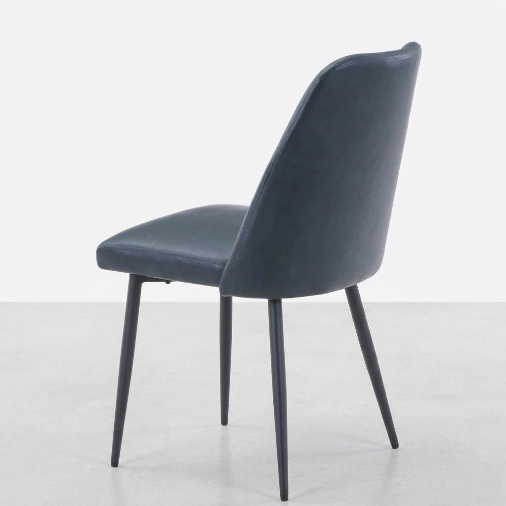 Dark gray chair with slender black legs, viewed from the back.