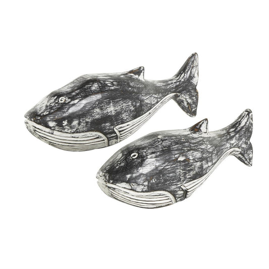Two carved wooden whale figures with a rustic finish.
