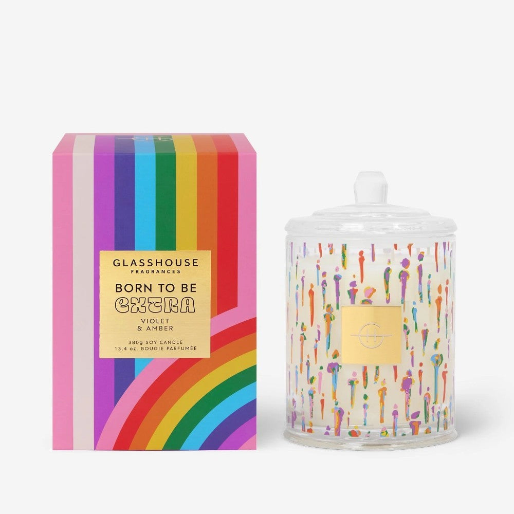 Colorful candle box and jar with vibrant rainbow designs.